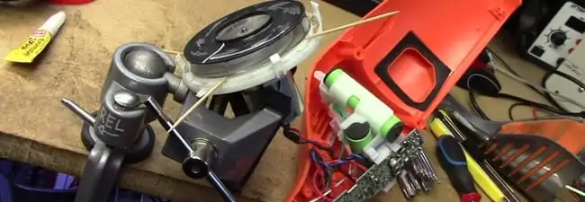 Vacuum cleaner repair parts and tools on a workbench in Los Angeles, CA