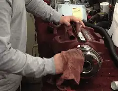 Vacuum repair technician cleaning and servicing a vacuum motor in Los Angeles, CA